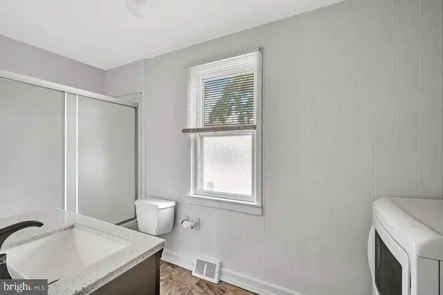 a bathroom with a sink and a toilet