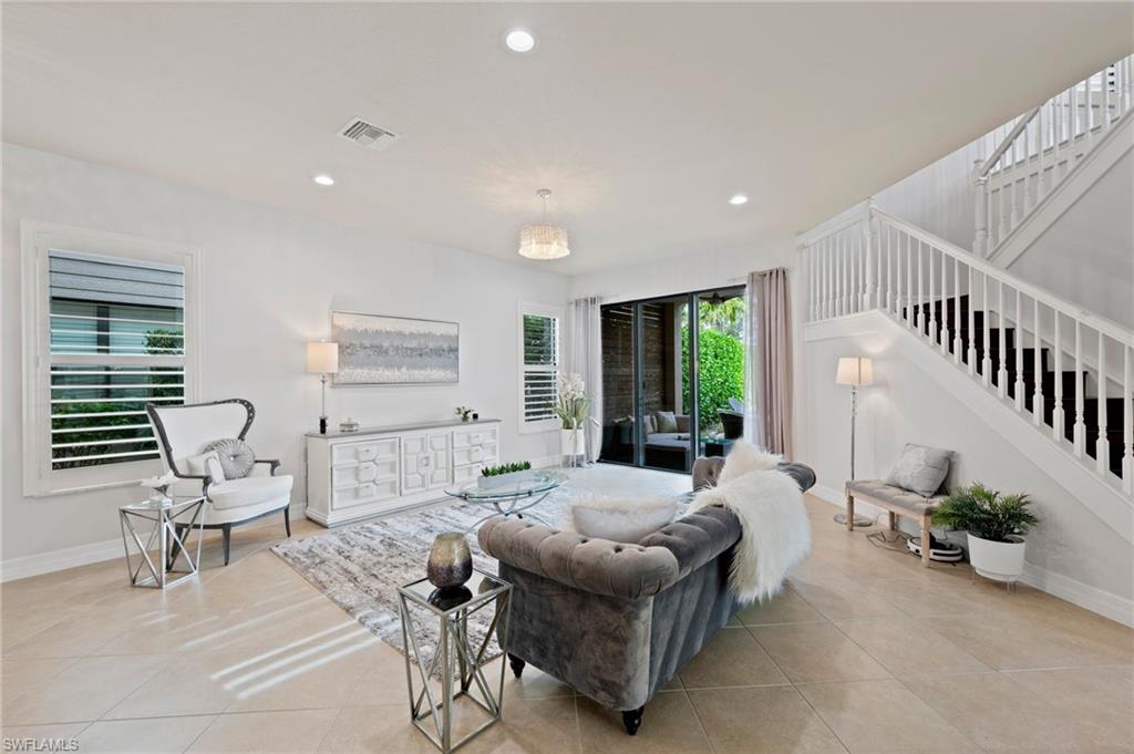 3082 Hudson Terrace Naples, FL 34119 - Photo 12 of 48 a living room with furniture and a large window