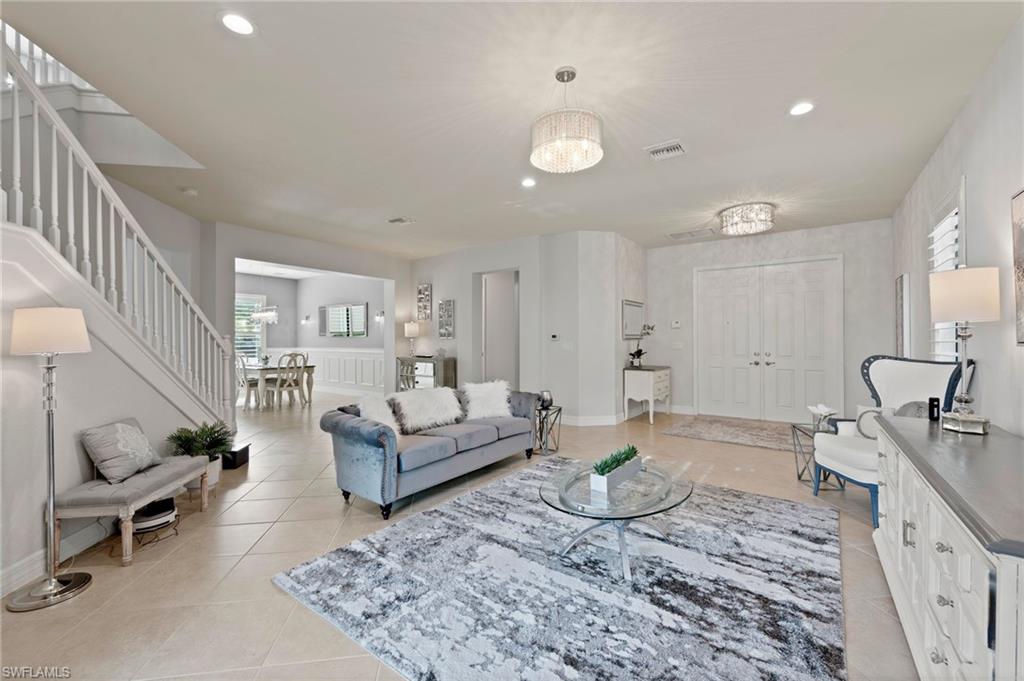 3082 Hudson Terrace Naples, FL 34119 - Photo 13 of 48 a living room with furniture and wooden floor
