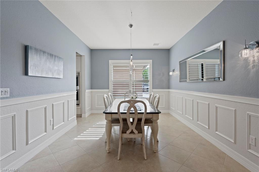 3082 Hudson Terrace Naples, FL 34119 - Photo 14 of 48 a view of a dining room with furniture window and outside view