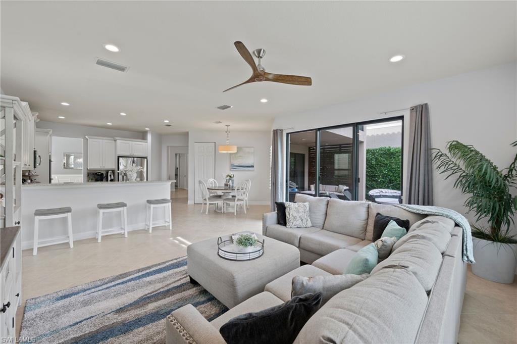 3082 Hudson Terrace Naples, FL 34119 - Photo 20 of 48 a living room with furniture and a large window
