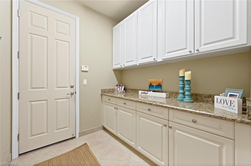 3082 Hudson Terrace Naples, FL 34119 - Photo 23 of 48 a kitchen with stainless steel appliances granite countertop white cabinets and a sink