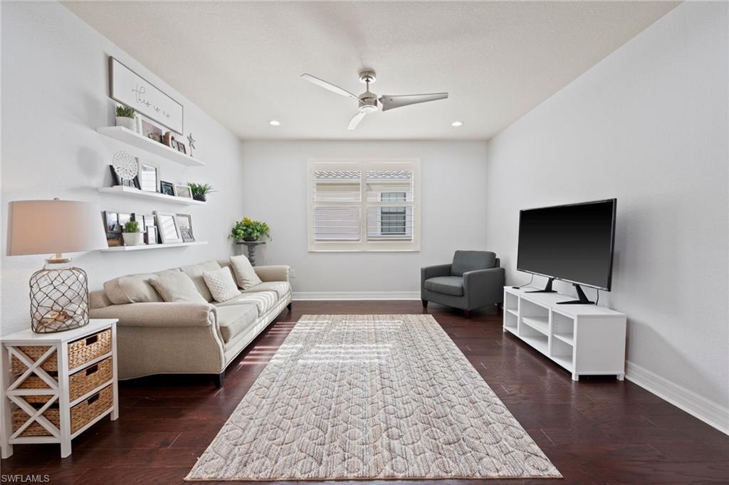 3082 Hudson Terrace Naples, FL 34119 - Photo 24 of 48 a living room with furniture and a flat screen tv