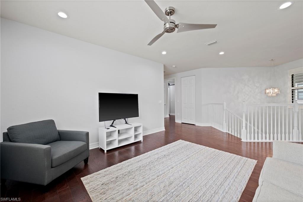 3082 Hudson Terrace Naples, FL 34119 - Photo 25 of 48 a living room with furniture and a flat screen tv