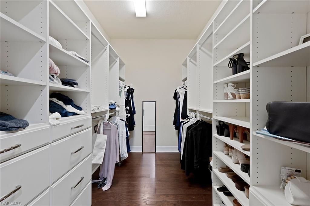 3082 Hudson Terrace Naples, FL 34119 - Photo 33 of 48 a view of walk in closet with clothes and shoes