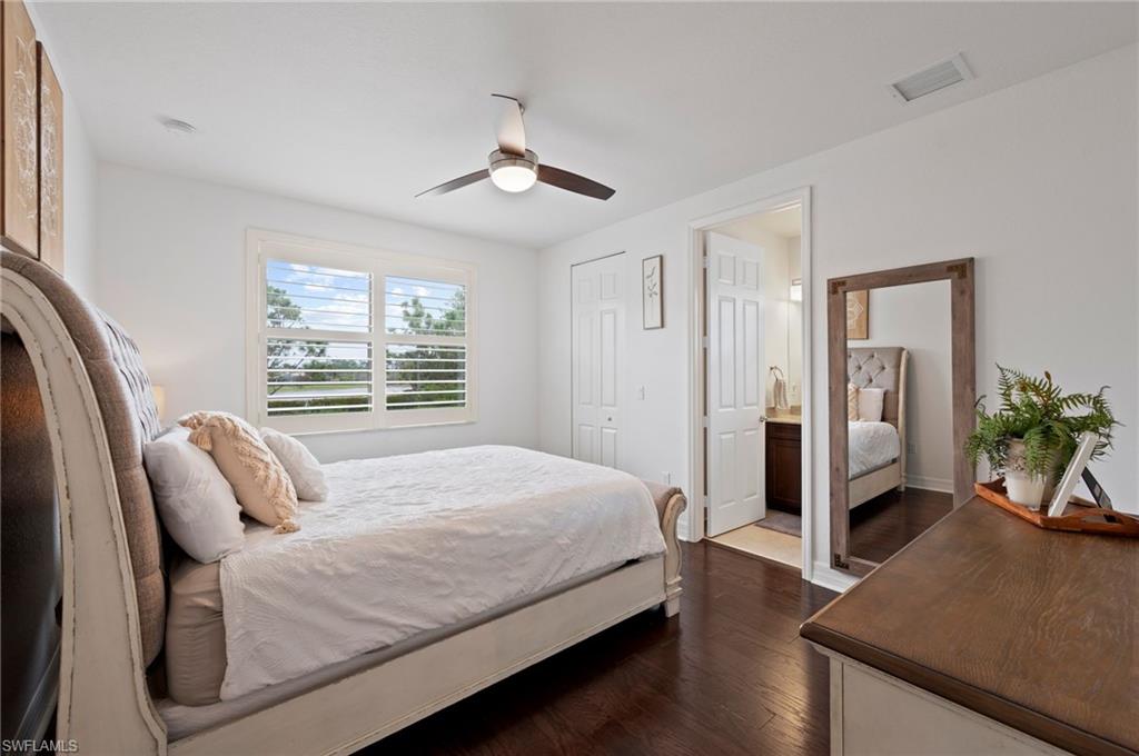 3082 Hudson Terrace Naples, FL 34119 - Photo 34 of 48 a bedroom with a bed and wooden floor