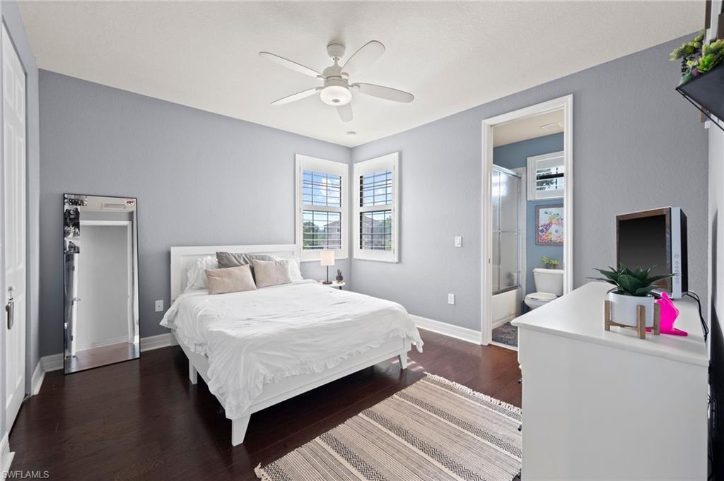 3082 Hudson Terrace Naples, FL 34119 - Photo 38 of 48 a bedroom with a bed and a chandelier