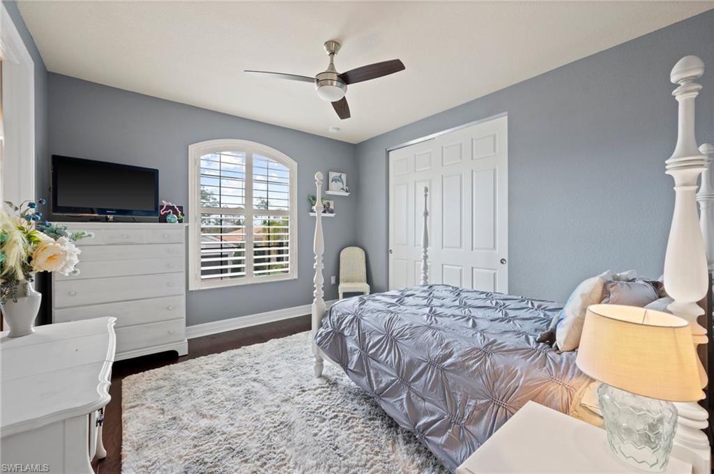 3082 Hudson Terrace Naples, FL 34119 - Photo 39 of 48 a bedroom with a bed and a flat screen tv