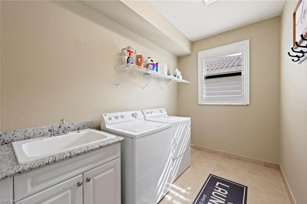 3082 Hudson Terrace Naples, FL 34119 - Photo 41 of 48 a utility room with dryer and washer