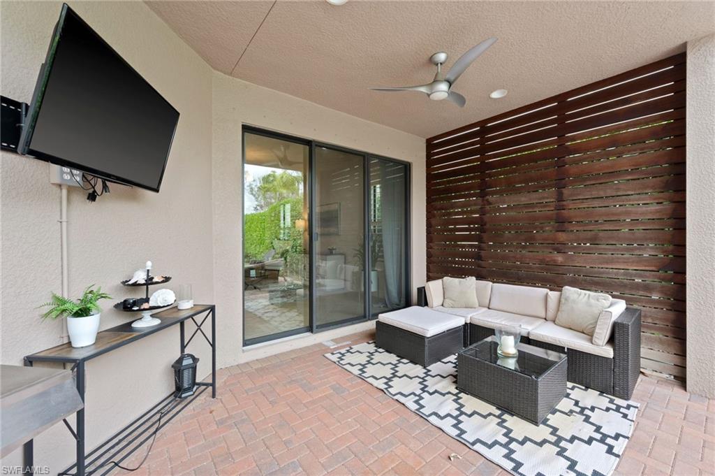 3082 Hudson Terrace Naples, FL 34119 - Photo 44 of 48 a living room with furniture and a flat screen tv