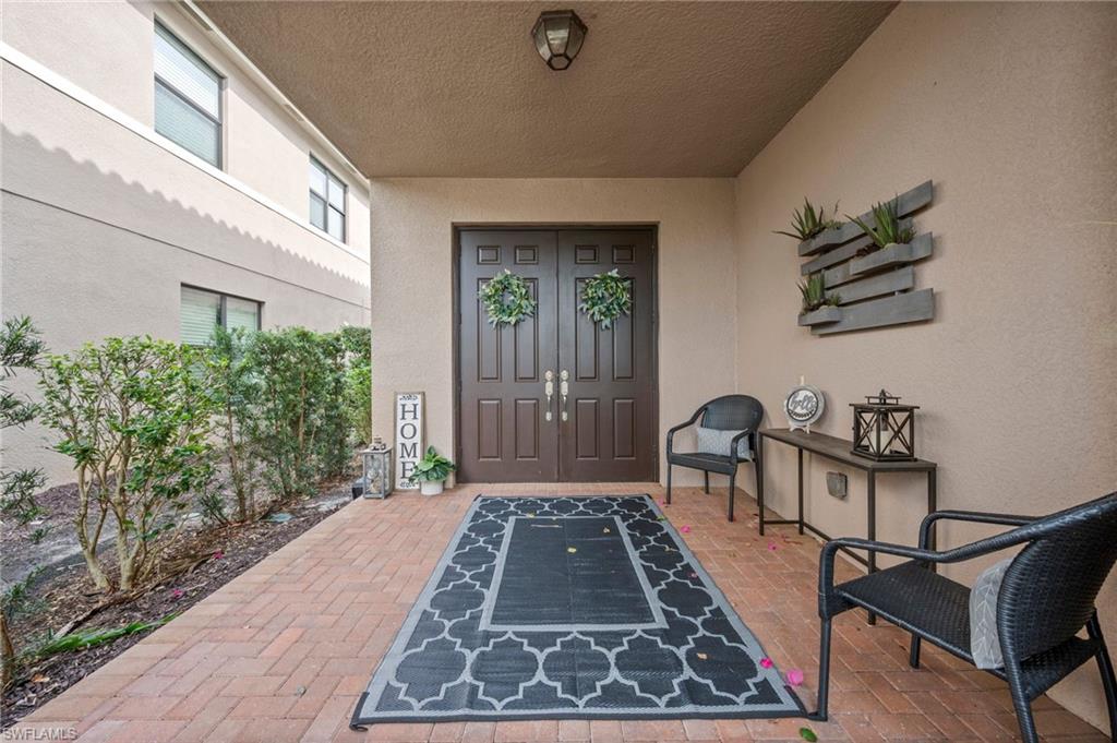 3082 Hudson Terrace Naples, FL 34119 - Photo 5 of 48 a front view of a house with garden