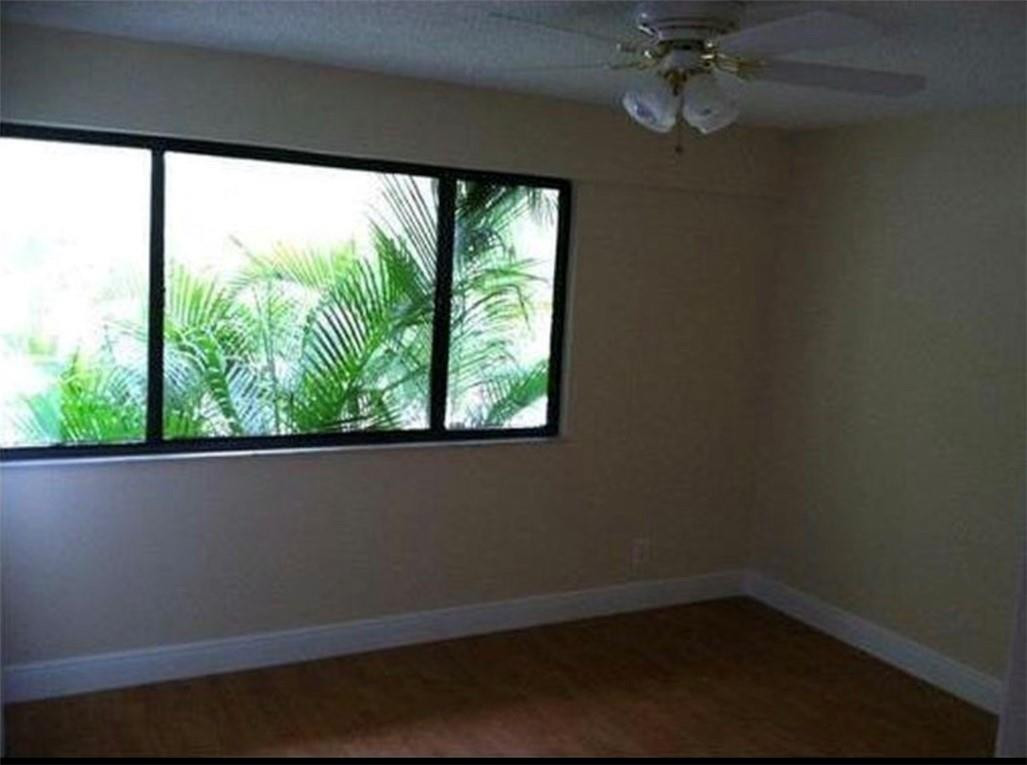 81 Deer Creek Road, Unit J103 Deerfield Beach, FL 33442 - Photo 5 of 8 a view of a room with a window