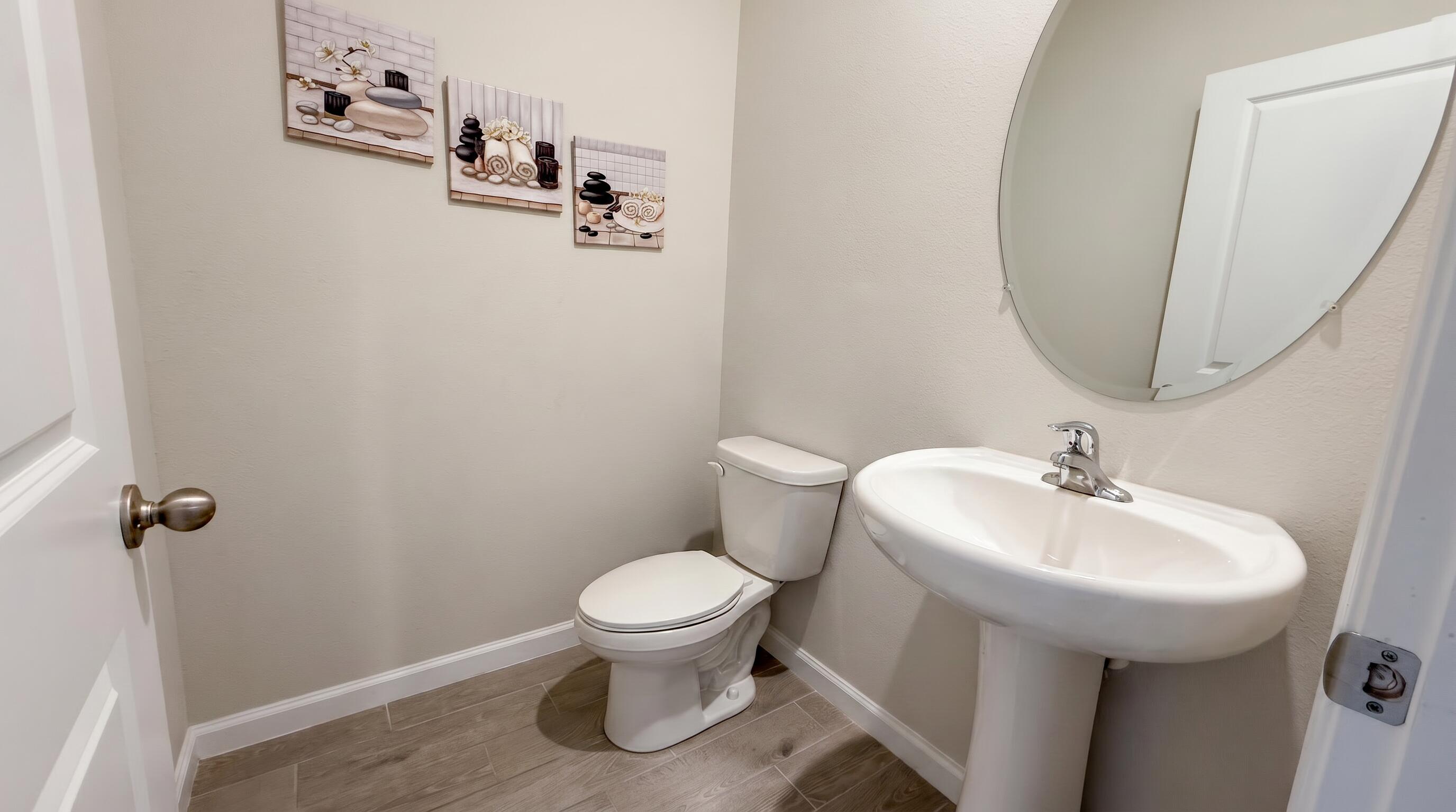5784 Southeast Edgewater Circle Stuart, FL 34997 - Photo 6 of 33 a bathroom with a sink toilet and a mirror