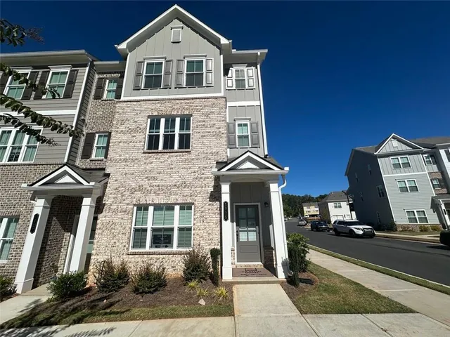 a front view of a house with a yard