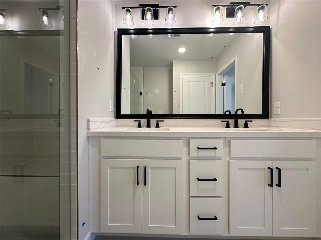 1925 Audra Alley Kennesaw, GA 30144 - Photo 17 of 24 a bathroom with a sink and a mirror