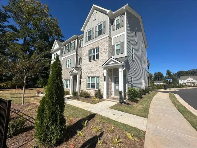 a view of a building with a yard