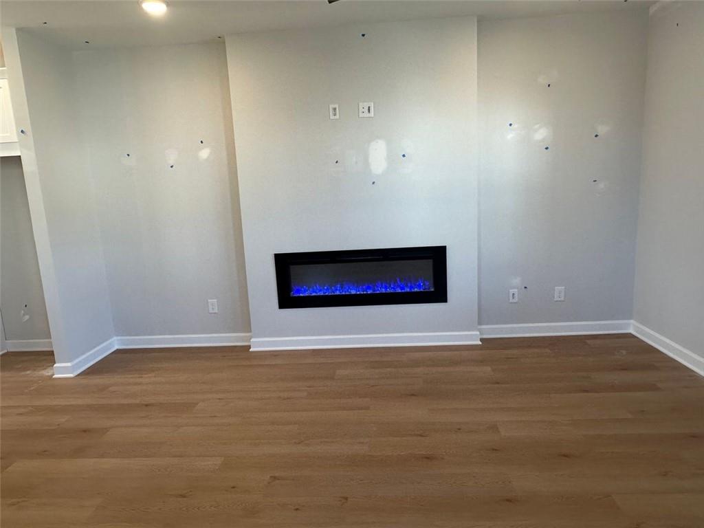 1925 Audra Alley Kennesaw, GA 30144 - Photo 21 of 24 a view of an empty room with wooden floor and a window