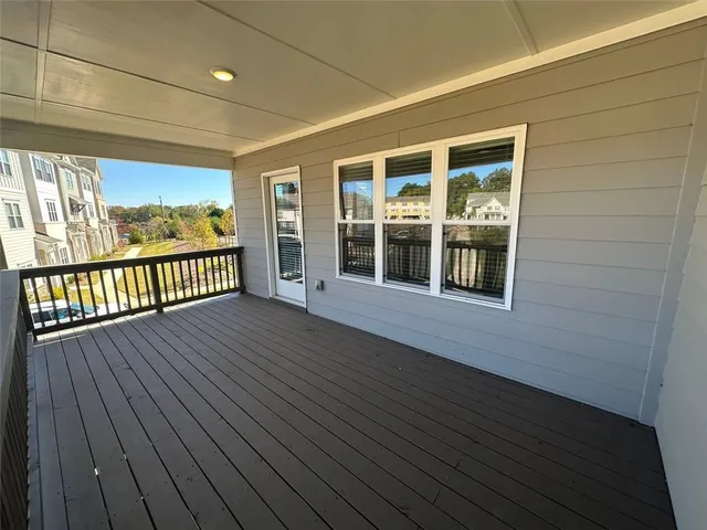a view of a balcony with cars