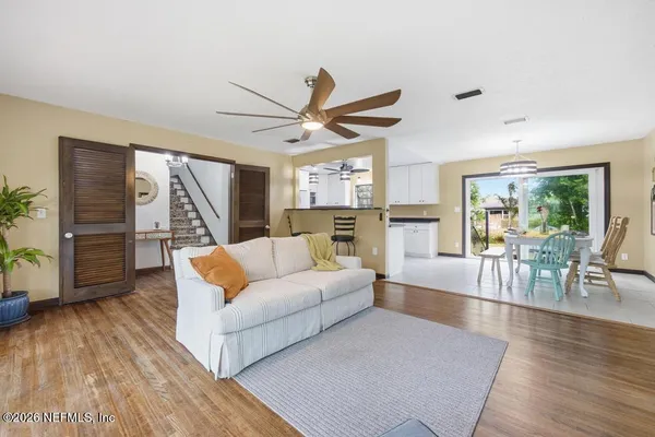 a living room with furniture and a large window