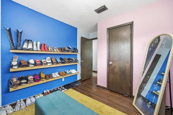 a room with lots of books and a book shelf
