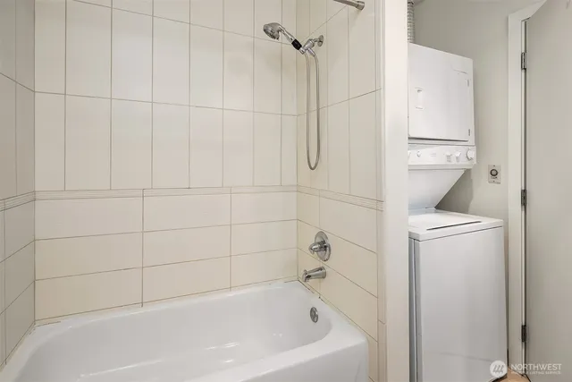 a bedroom with a bed and a potted plant on the dresser