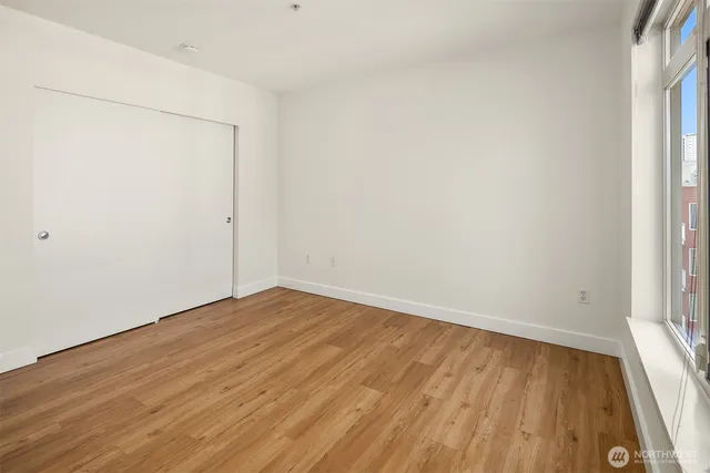 a view of a kitchen from a hallway
