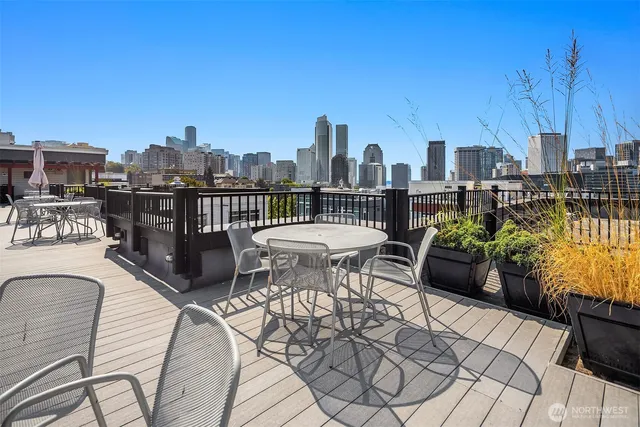 a view of a livingroom with furniture and a flat screen tv