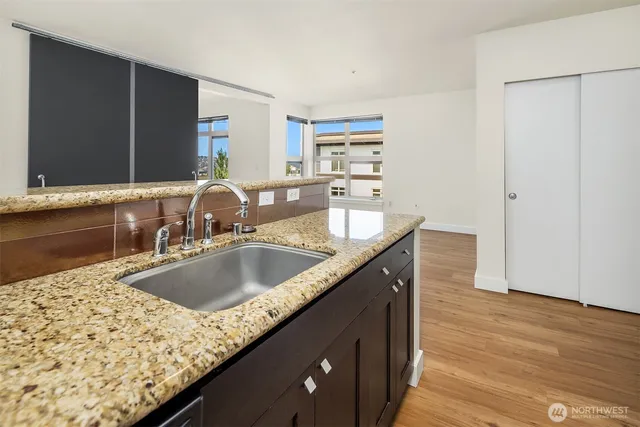 a white toilet sitting next to a white sink