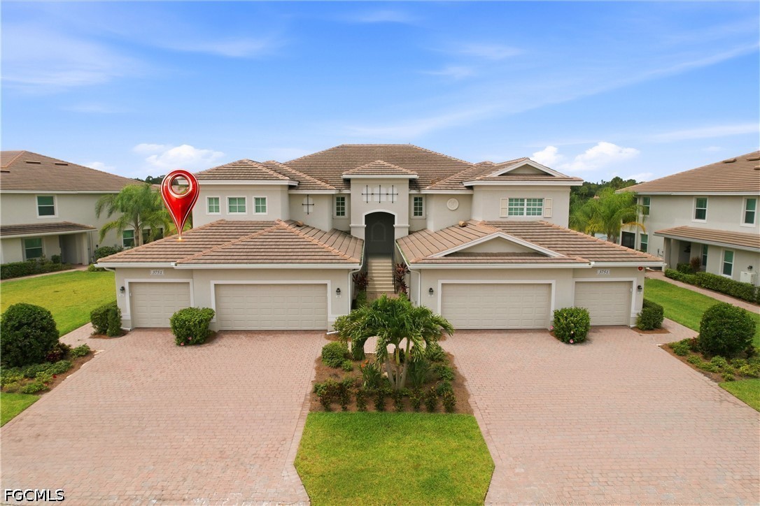 3751 Pebblebrook Ridge Court, Unit 101 Fort Myers, FL 33905 - Photo 44 of 48 a front view of a house with garden
