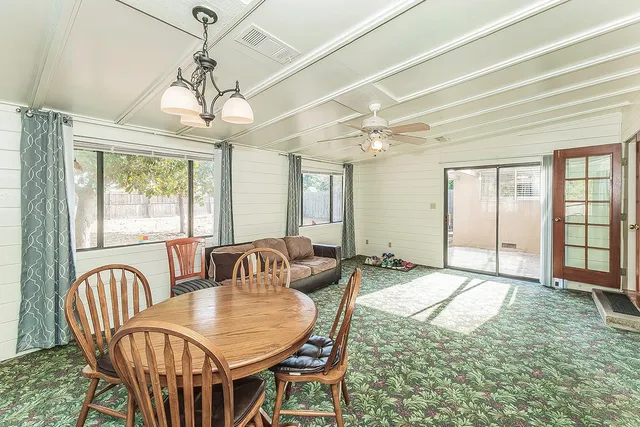 a view of a dining room with furniture window and outside view