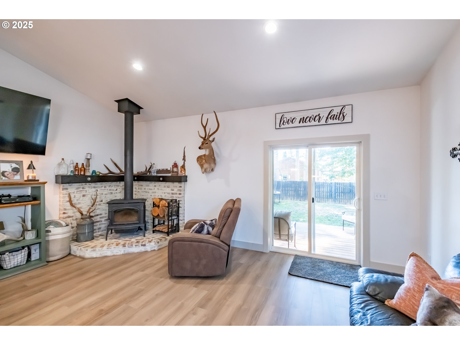 547 West Fourth Street Coquille, OR 97423 - Photo 21 of 48 a living room with furniture and a fireplace