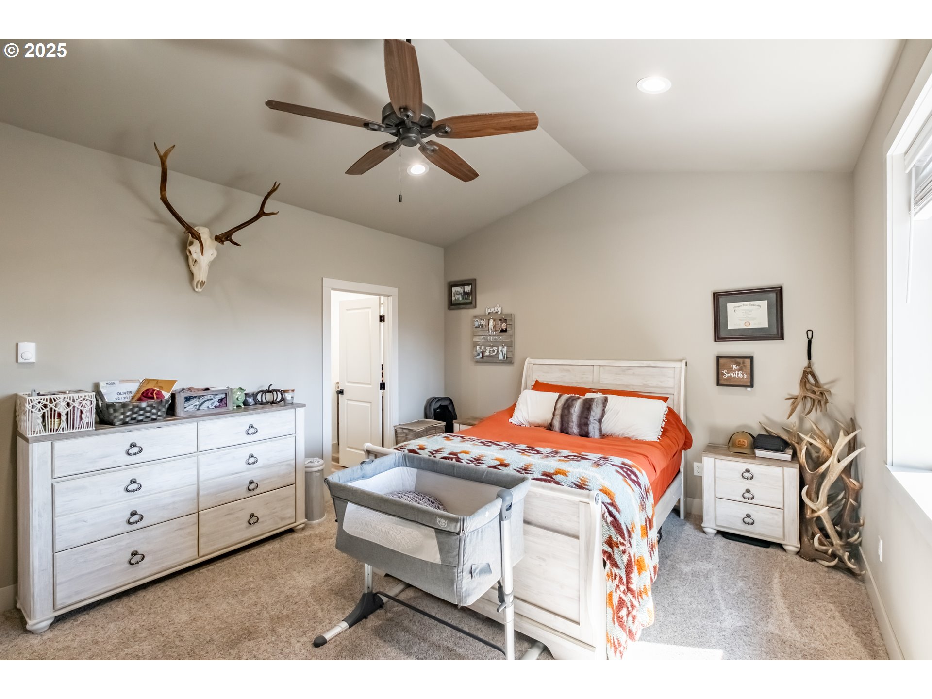 547 West Fourth Street Coquille, OR 97423 - Photo 24 of 48 a bedroom with a bed and a chandelier