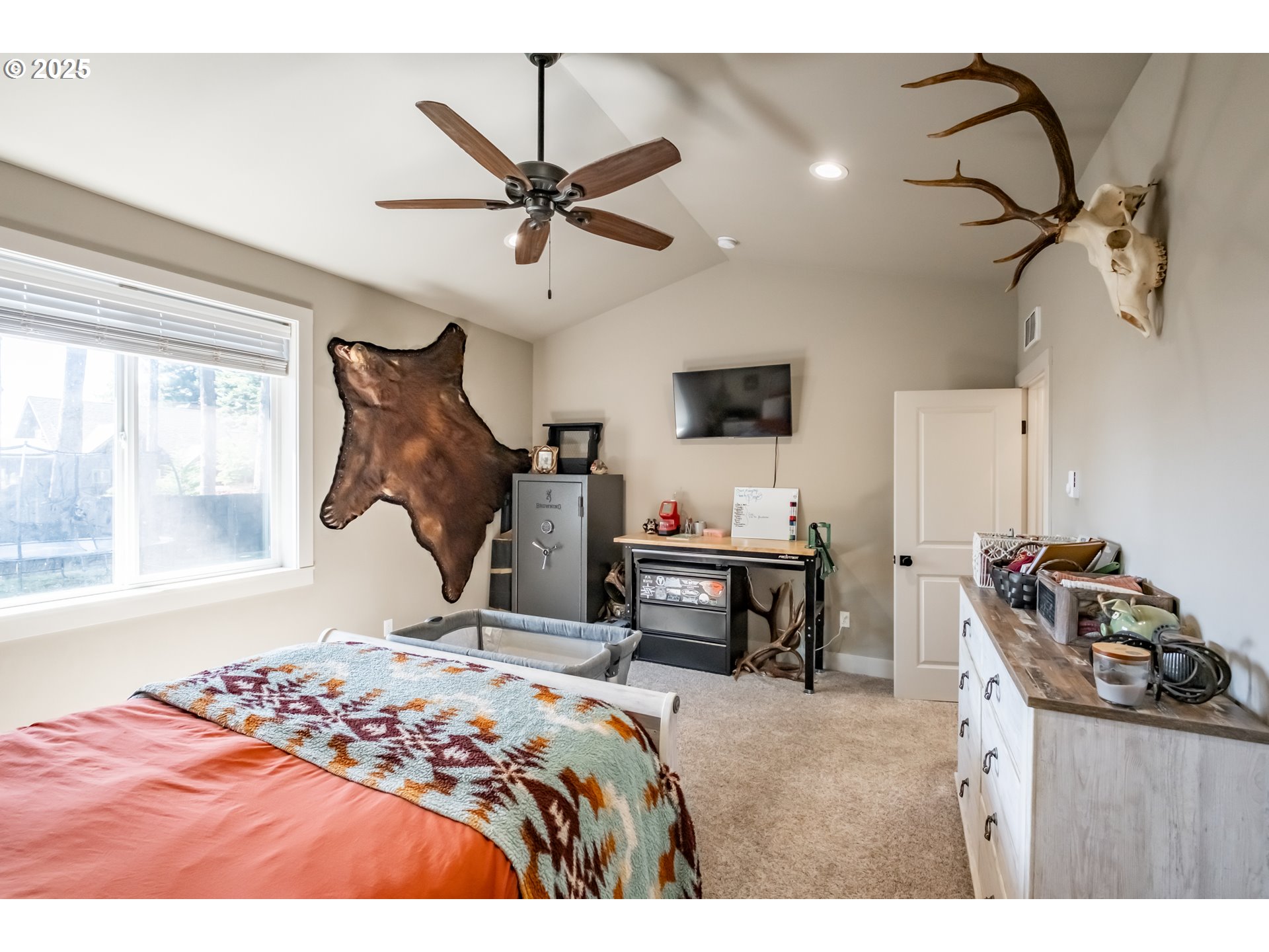 547 West Fourth Street Coquille, OR 97423 - Photo 27 of 48 a bedroom with a bed and a chandelier
