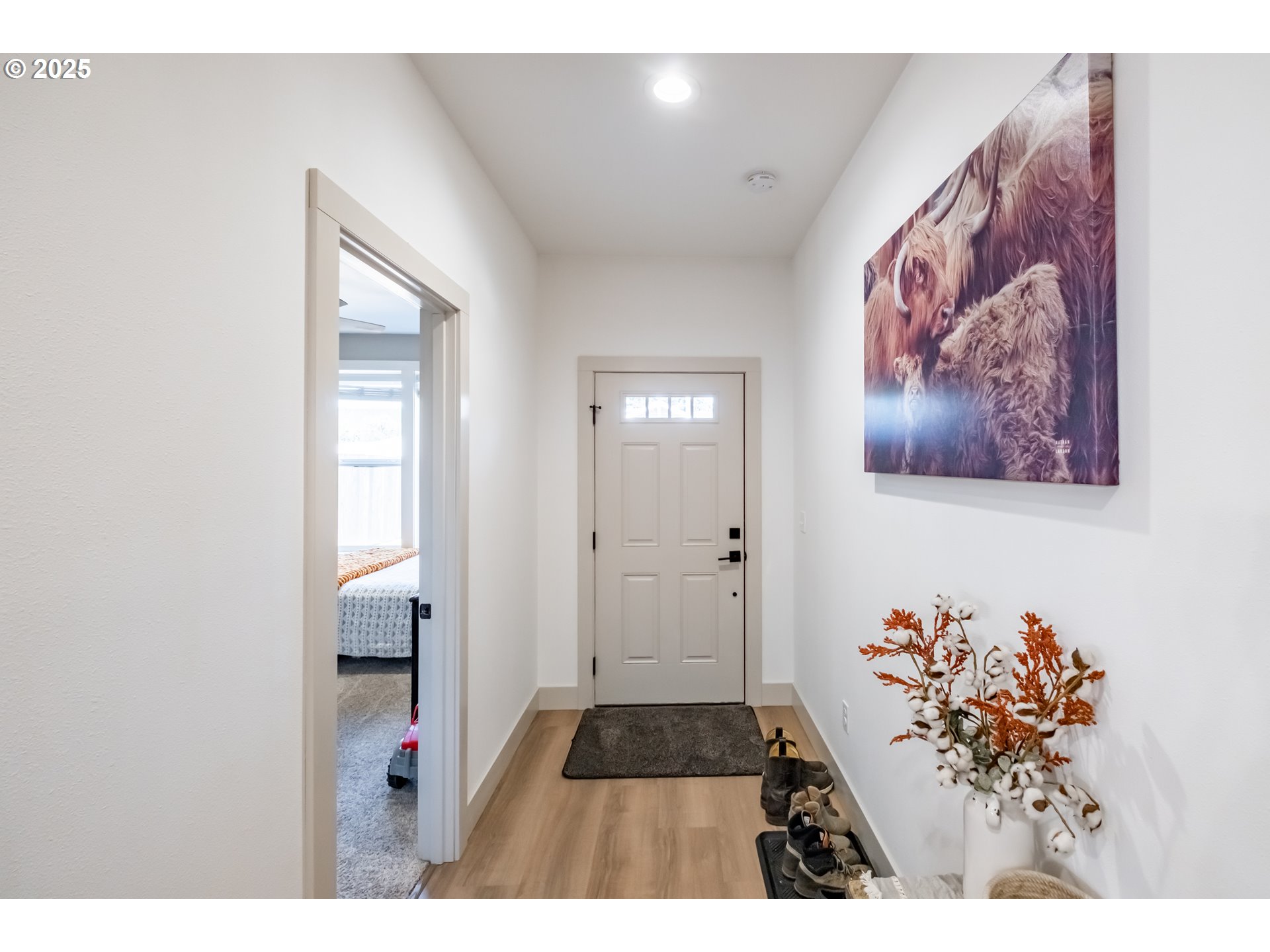 547 West Fourth Street Coquille, OR 97423 - Photo 6 of 48 a picture of a room with wooden floor and wall paintings