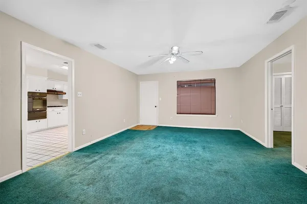 an empty room with closet and a projector