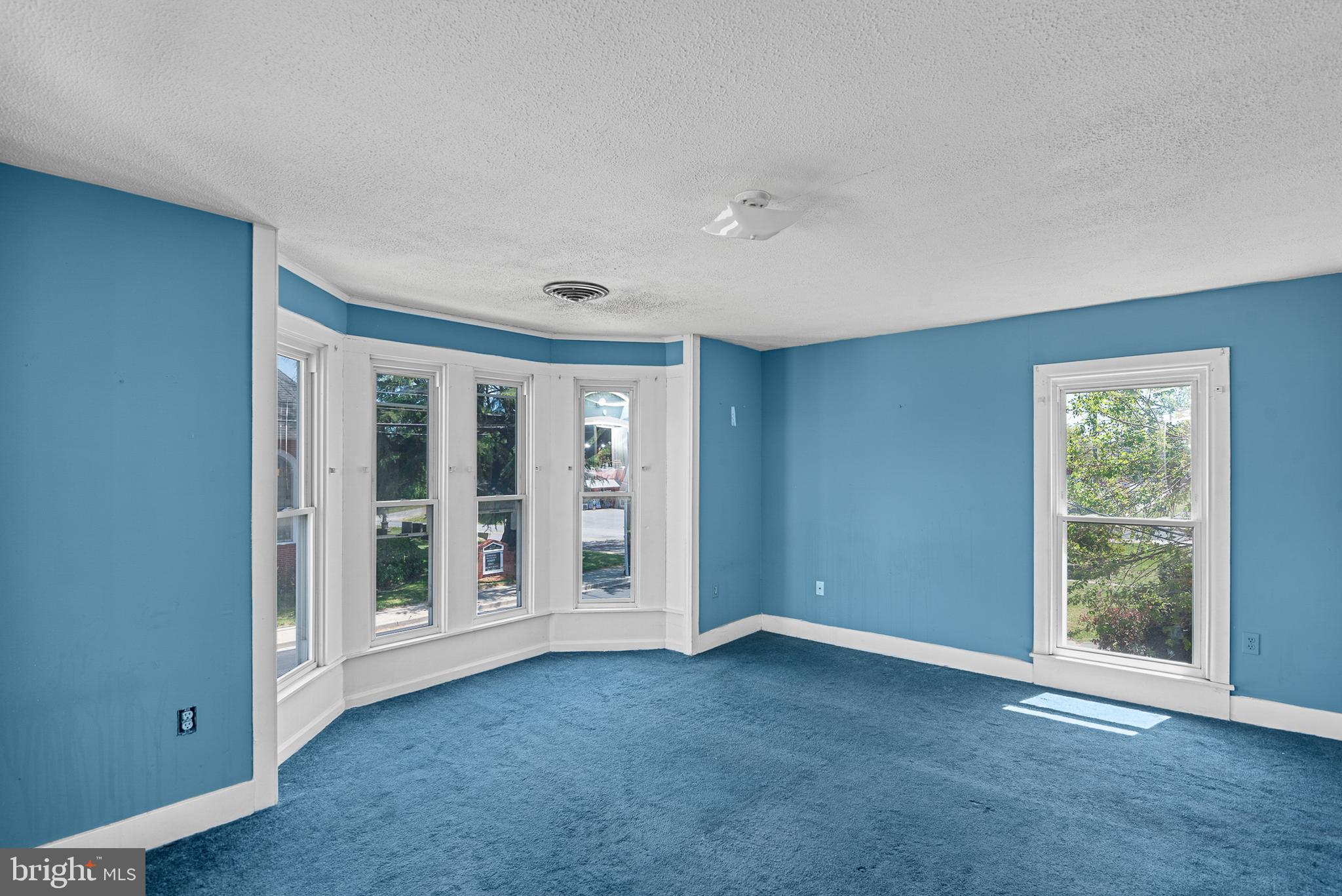 156 Main Street Preston, MD 21655 - Photo 11 of 18 a view of an empty room with a window