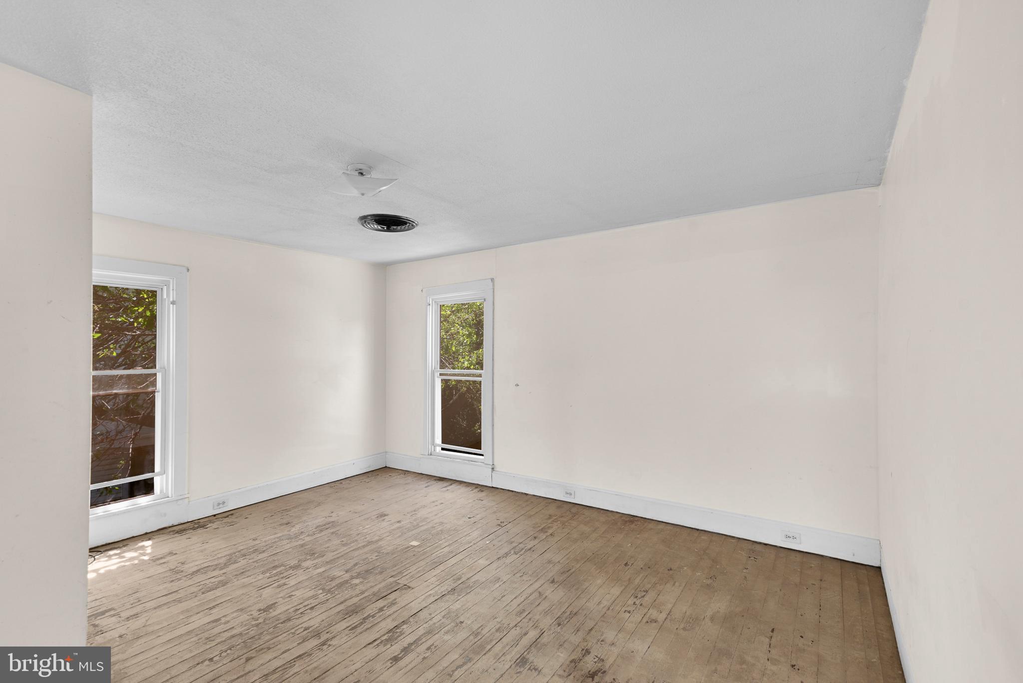 156 Main Street Preston, MD 21655 - Photo 12 of 18 wooden floor in an empty room