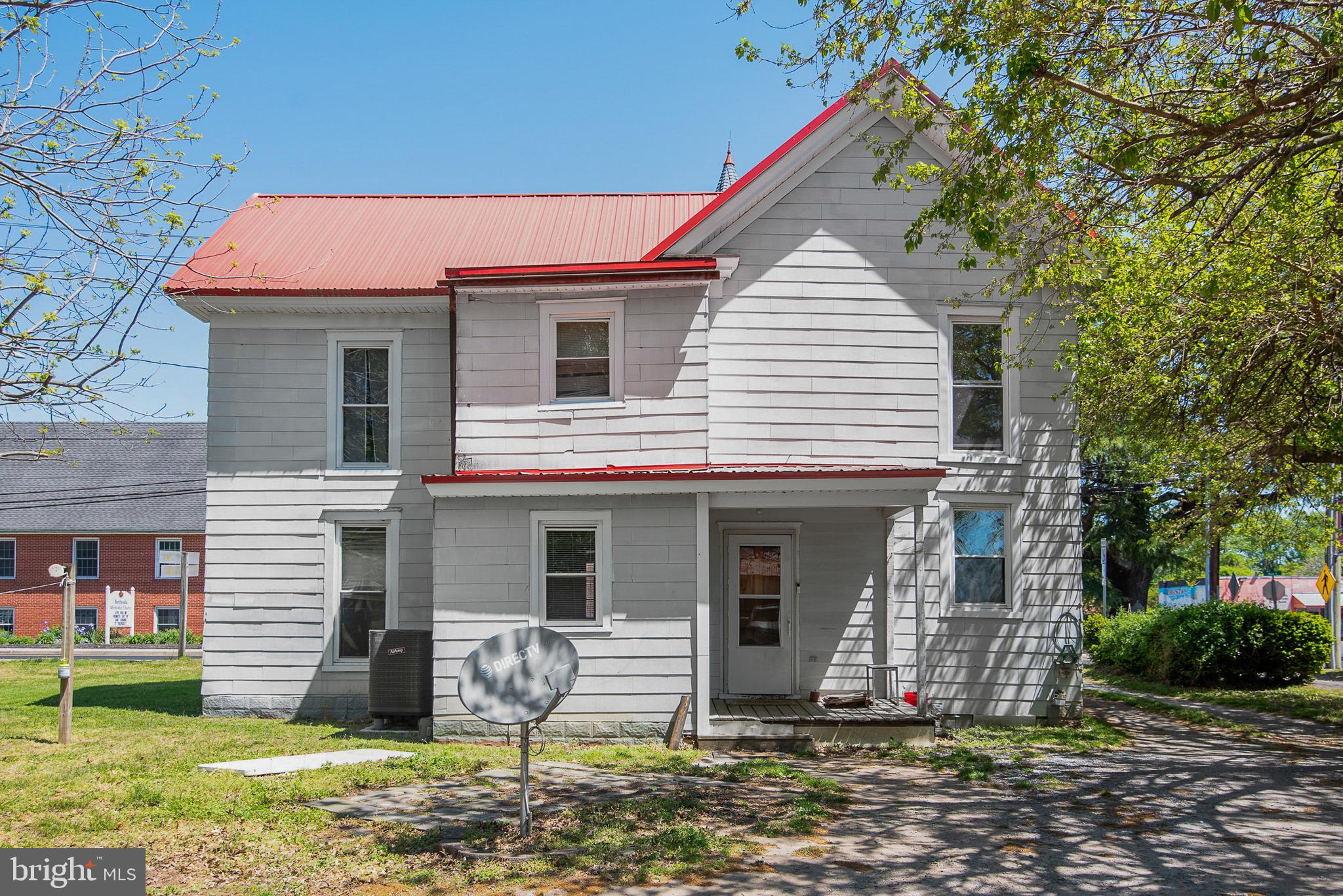 156 Main Street Preston, MD 21655 - Photo 15 of 18 a front view of a house with garden