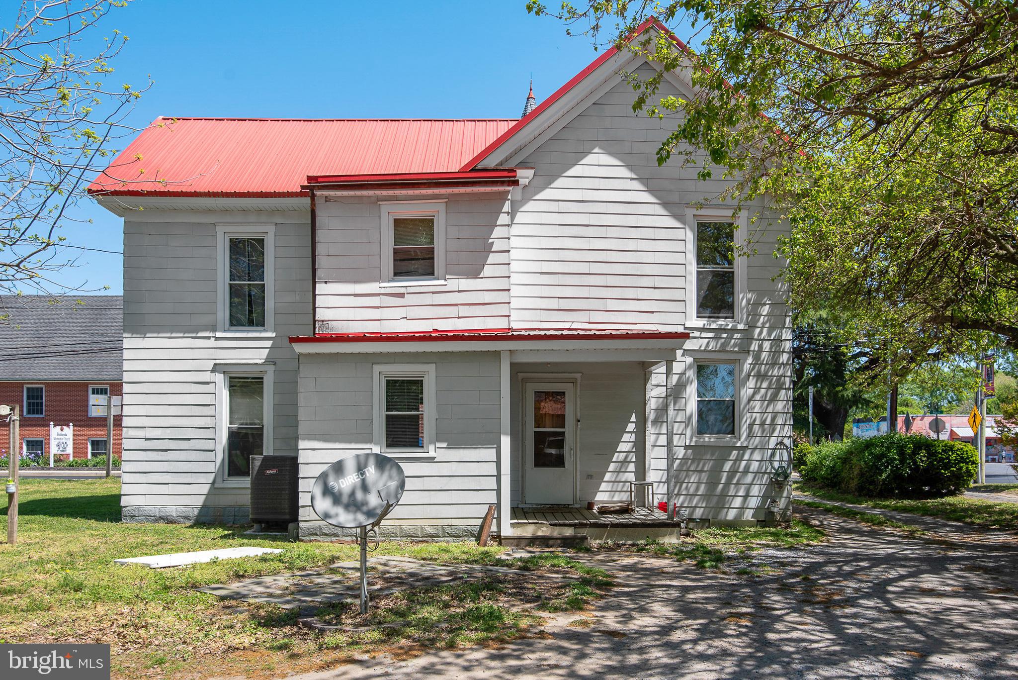 156 Main Street Preston, MD 21655 - Photo 16 of 18 a front view of a house with a yard