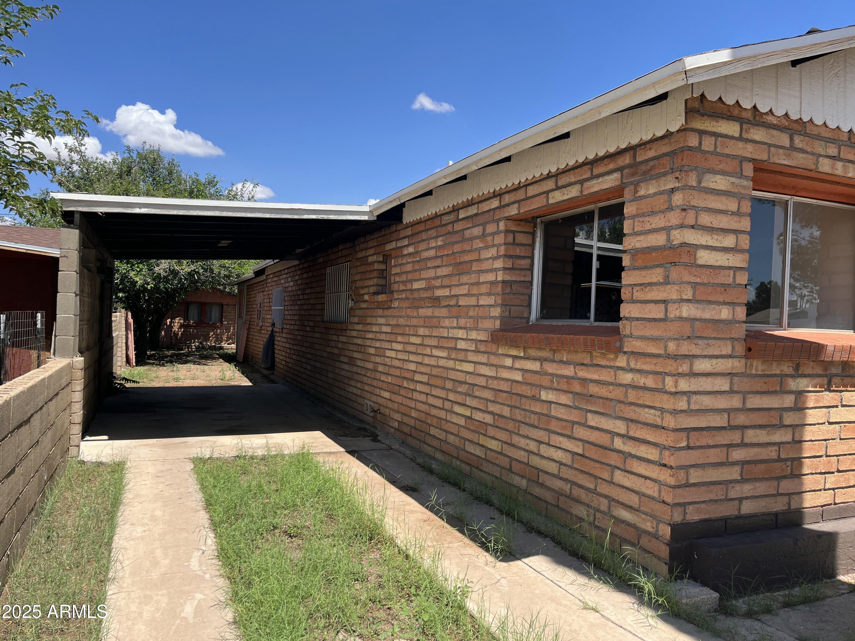 1324 6th Green Street Douglas, AZ 85607 - Photo 15 of 20 a front view of a house with a yard