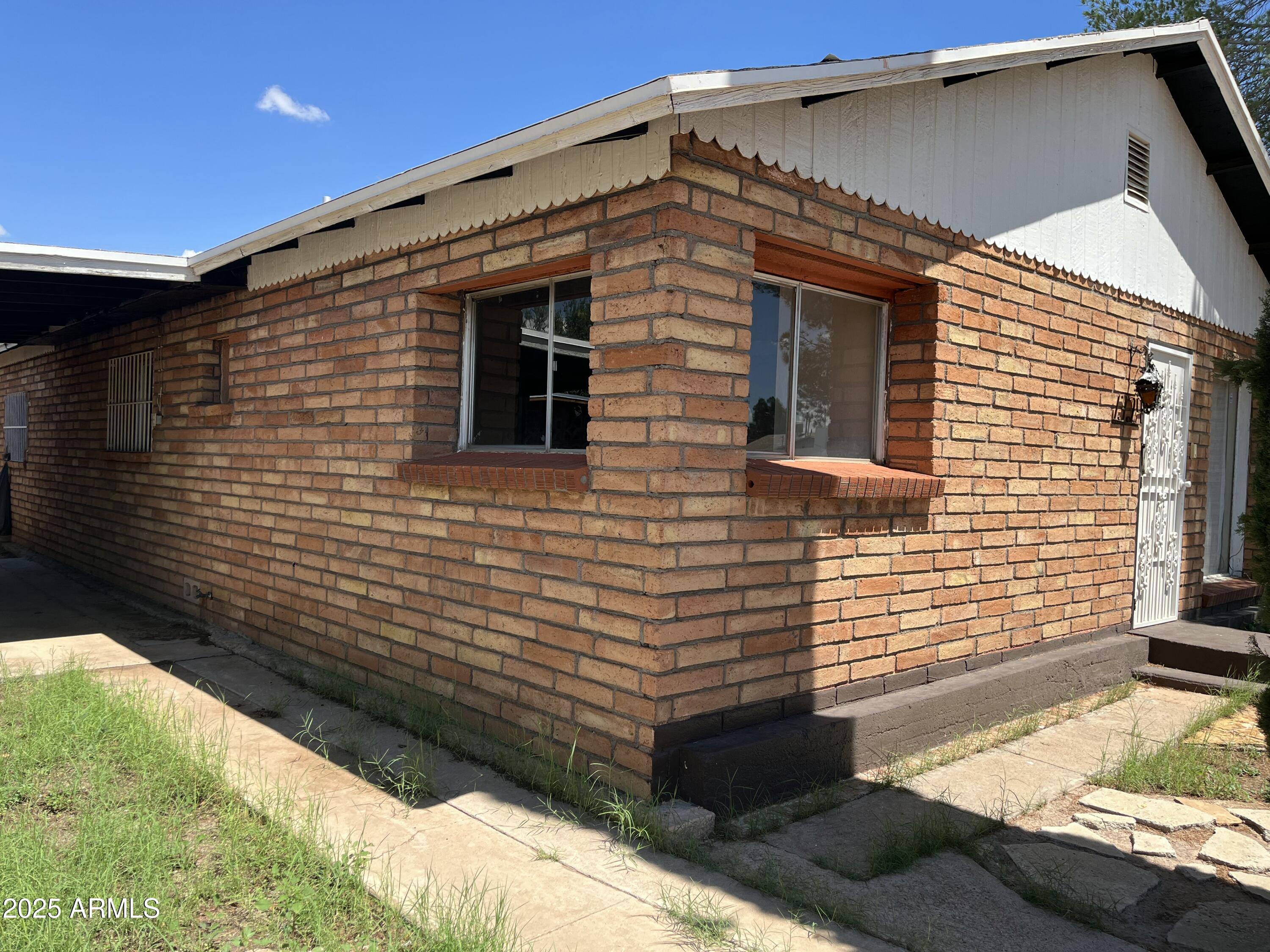 1324 6th Green Street Douglas, AZ 85607 - Photo 16 of 20 a view of a house with a yard