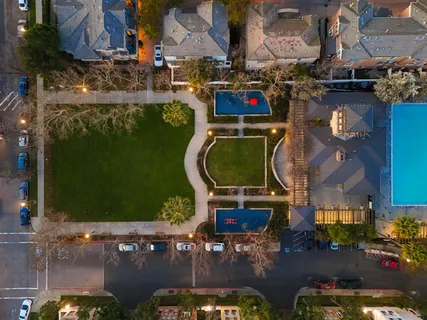 an aerial view of residential houses with outdoor space