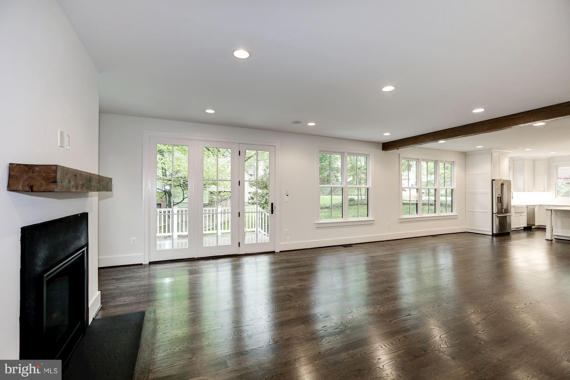 3030 North Stuart Street Arlington, VA 22207 - Photo 13 of 29 a view of empty room with wooden floor and fireplace