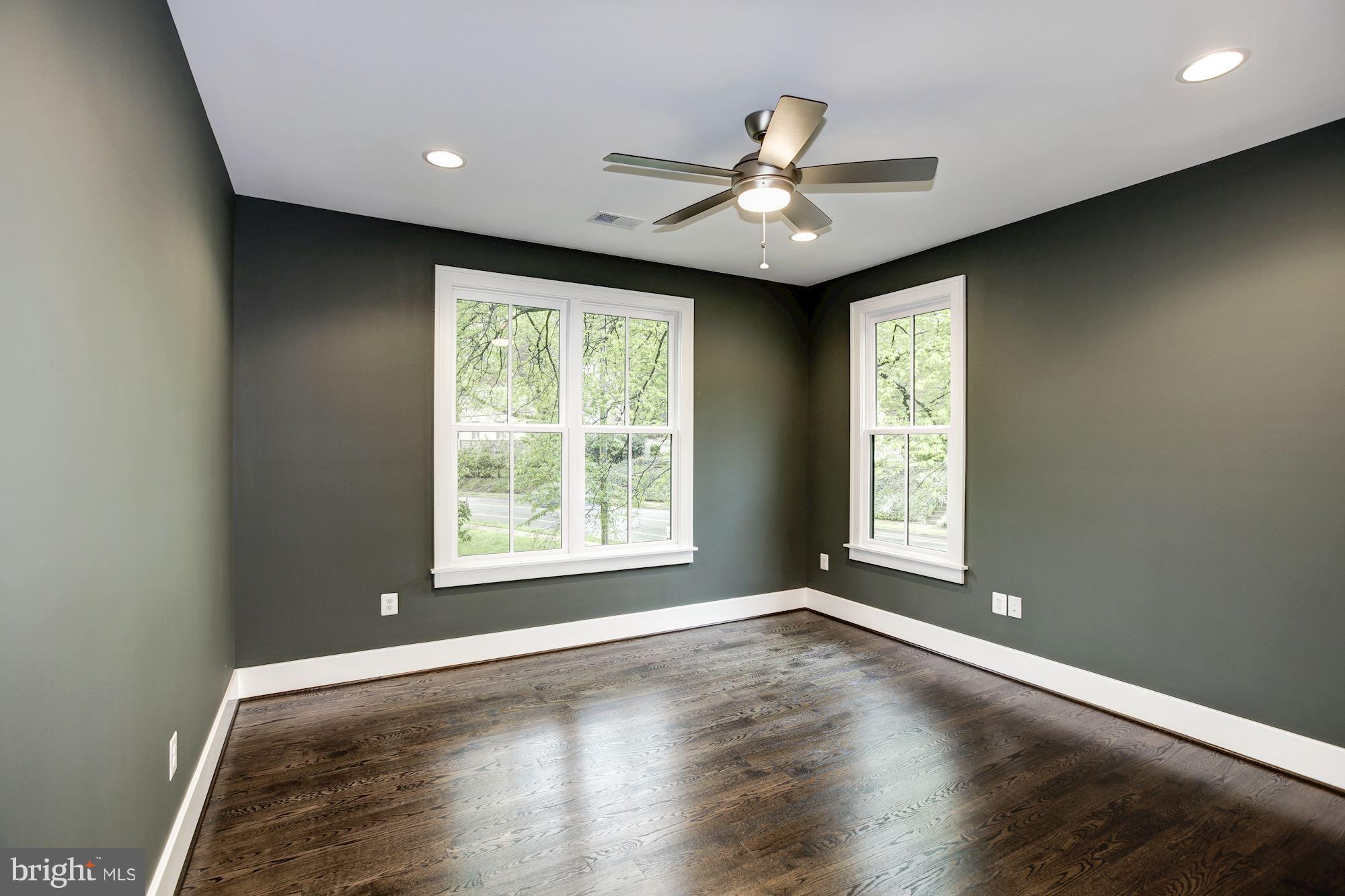 3030 North Stuart Street Arlington, VA 22207 - Photo 20 of 29 a view of an empty room with wooden floor and a window