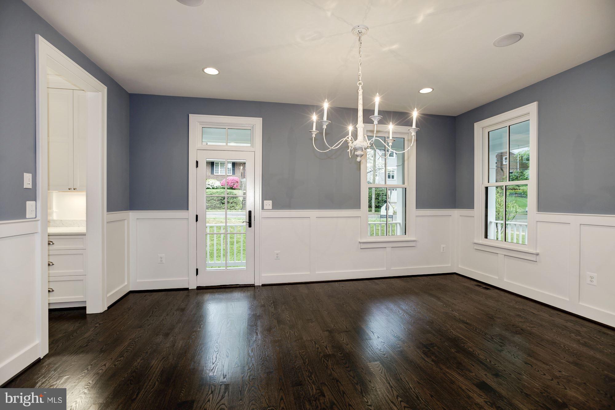 3030 North Stuart Street Arlington, VA 22207 - Photo 3 of 29 an empty room with wooden floor and windows