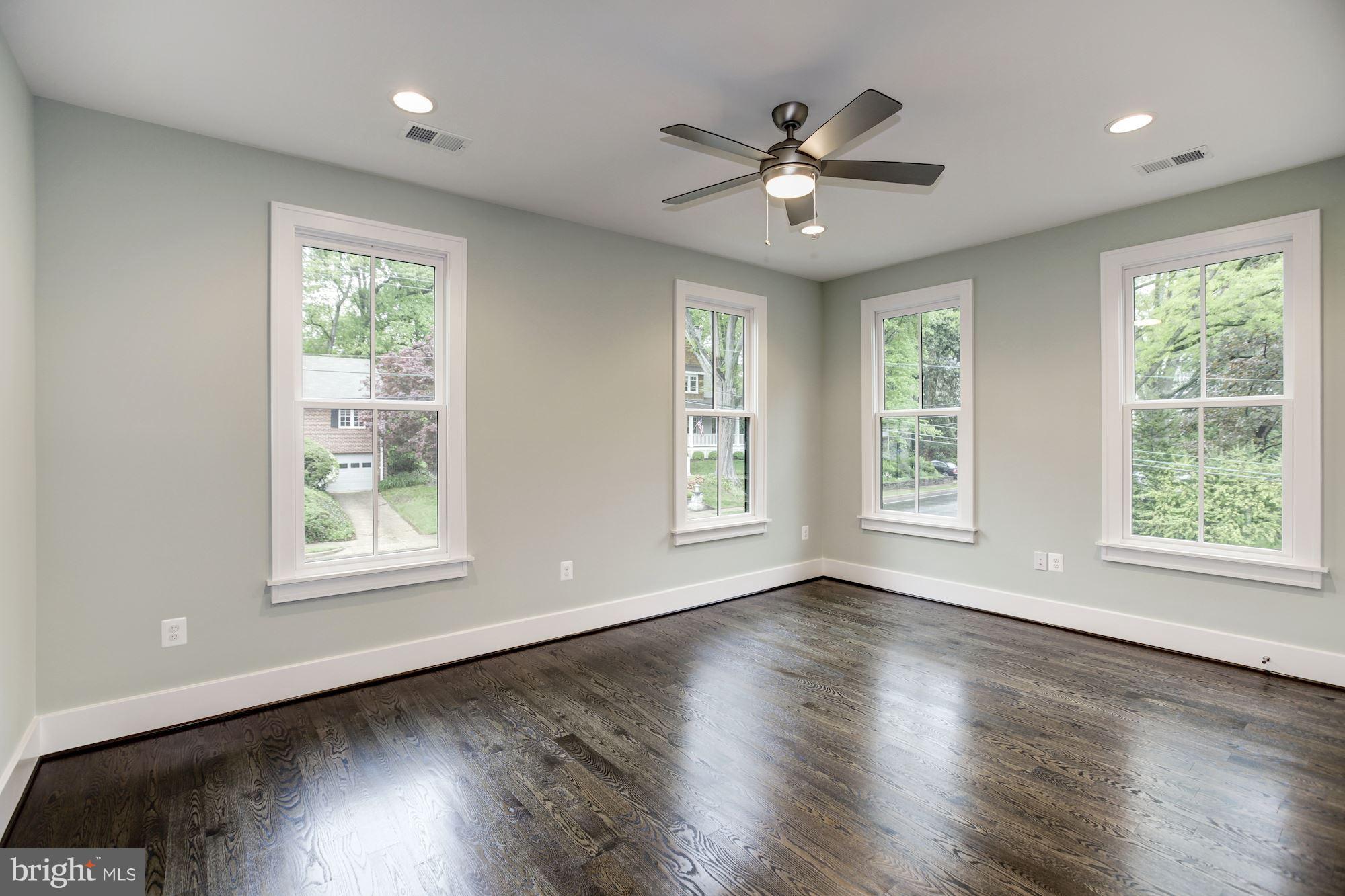 3030 North Stuart Street Arlington, VA 22207 - Photo 21 of 29 a view of an empty room with wooden floor and a window