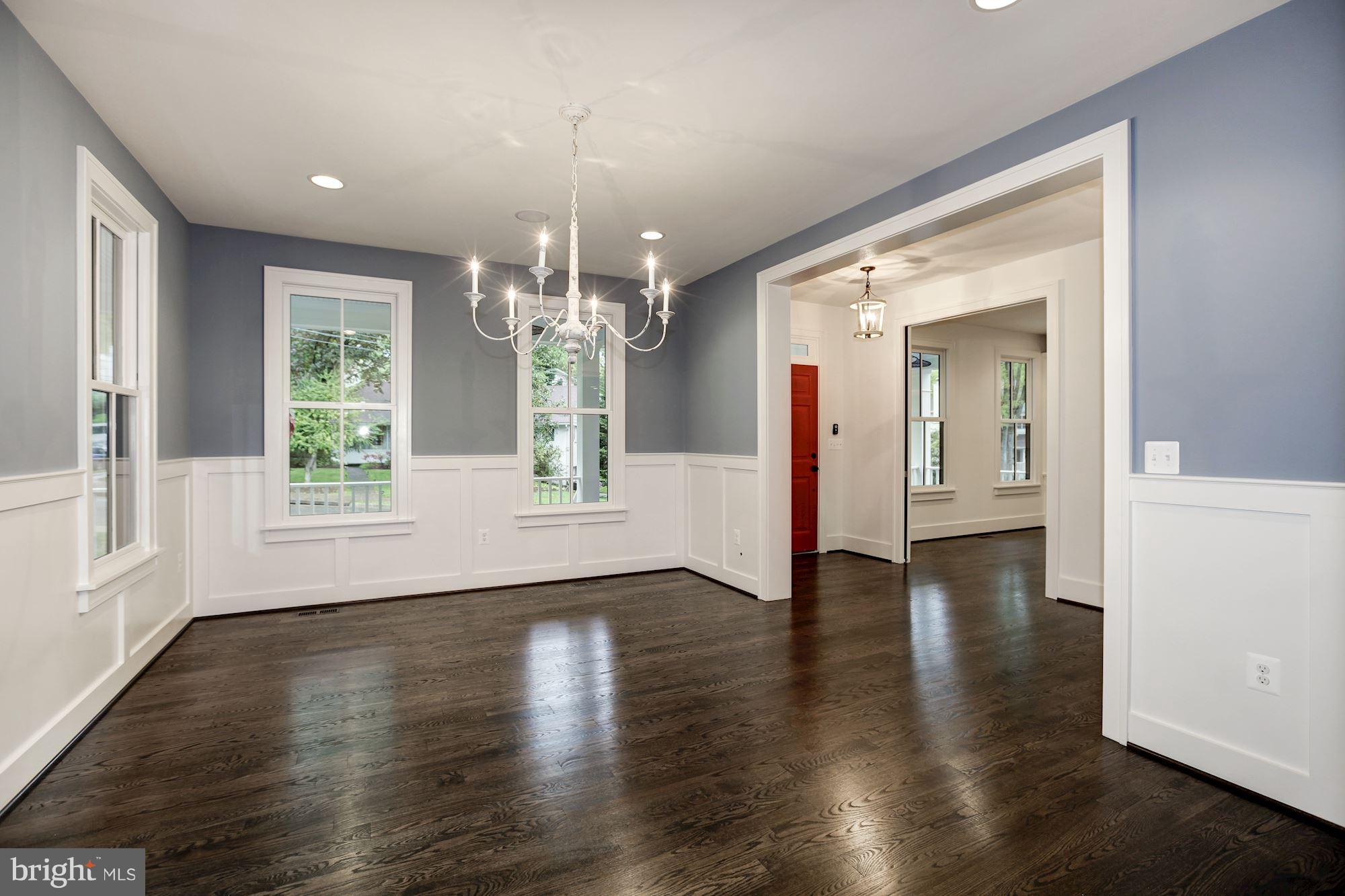 3030 North Stuart Street Arlington, VA 22207 - Photo 4 of 29 an empty room with wooden floor and windows