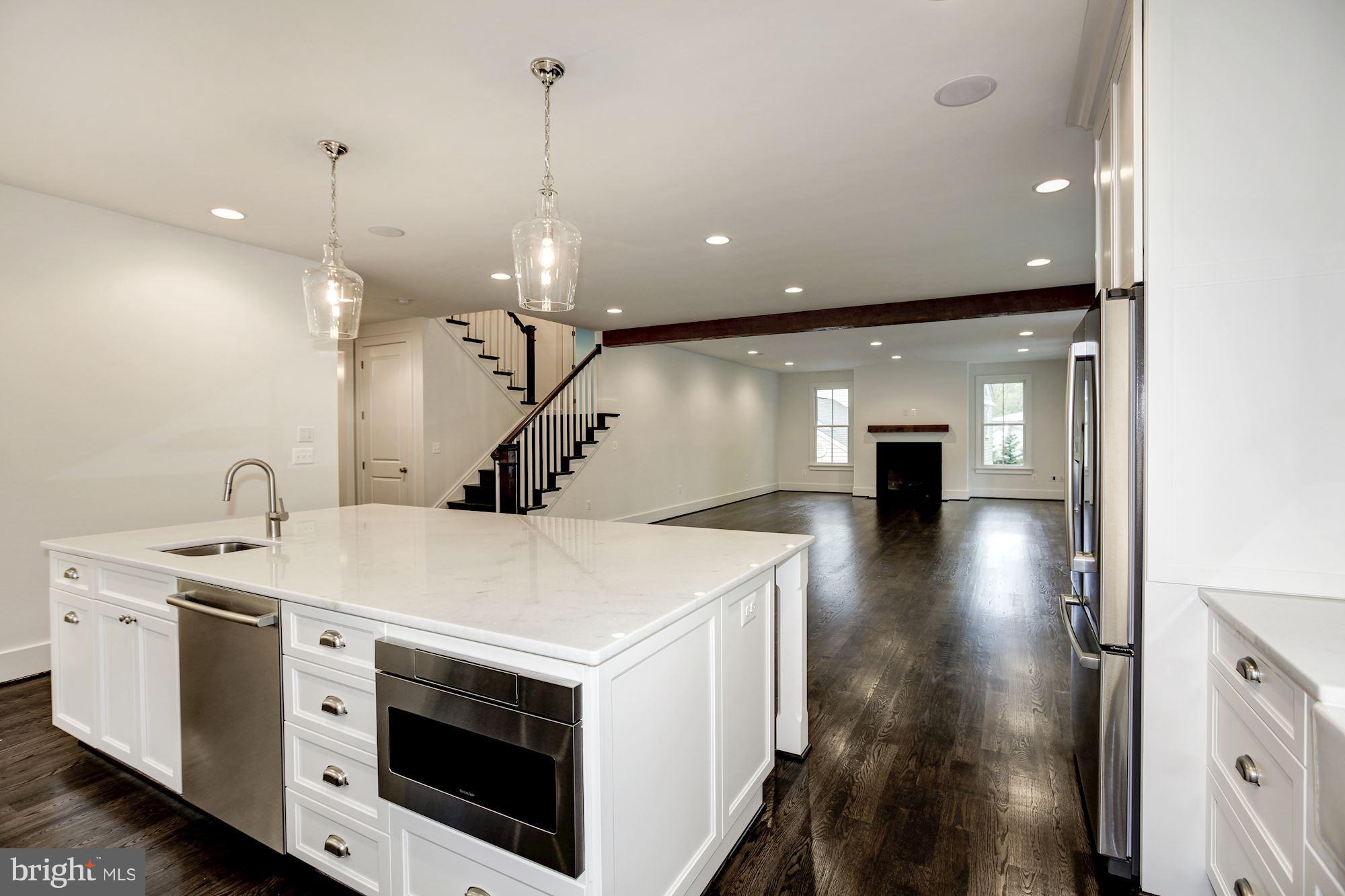 3030 North Stuart Street Arlington, VA 22207 - Photo 6 of 29 a view of a kitchen with a sink and stove