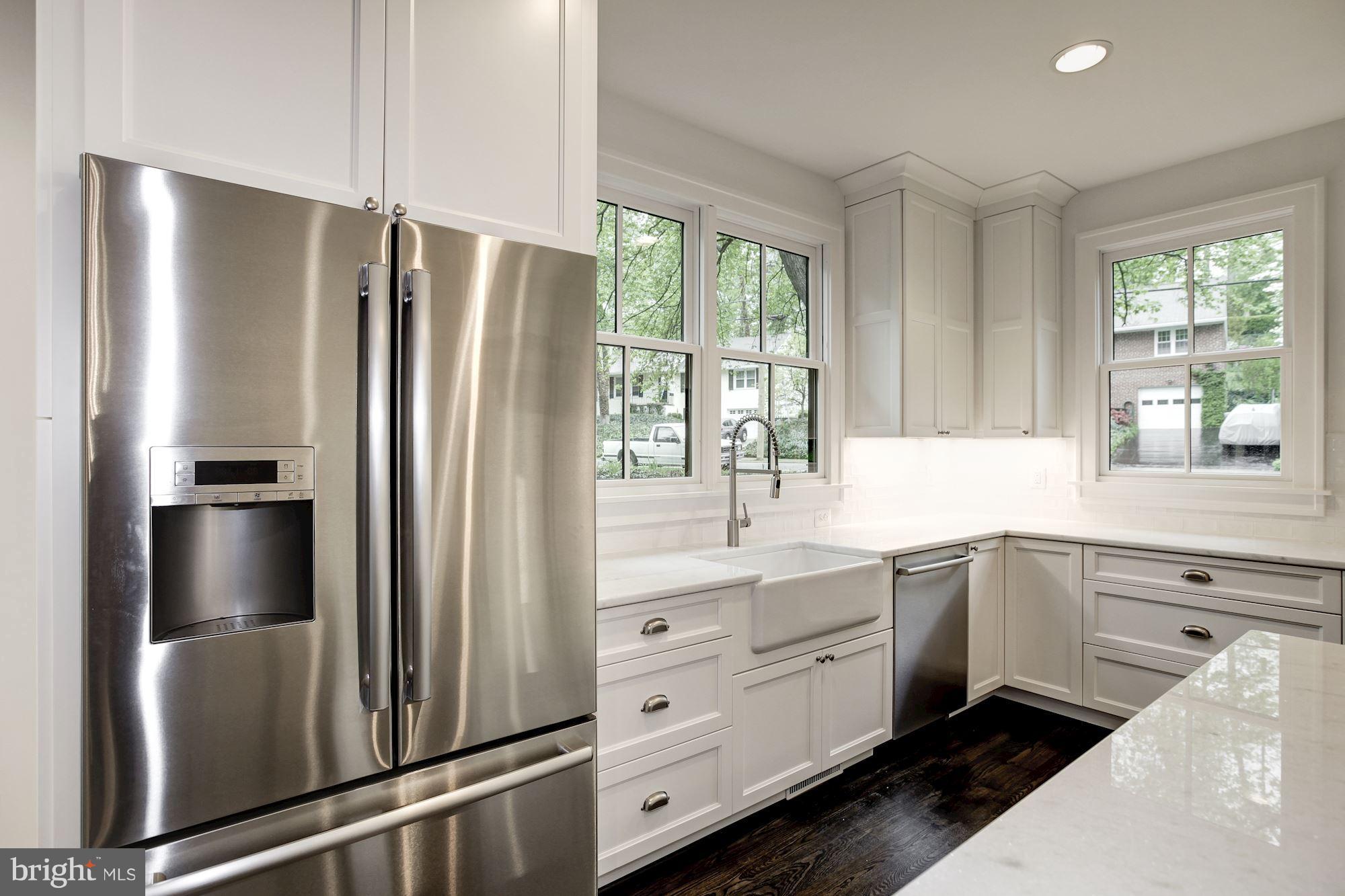 3030 North Stuart Street Arlington, VA 22207 - Photo 9 of 29 a kitchen with white cabinets and a refrigerator