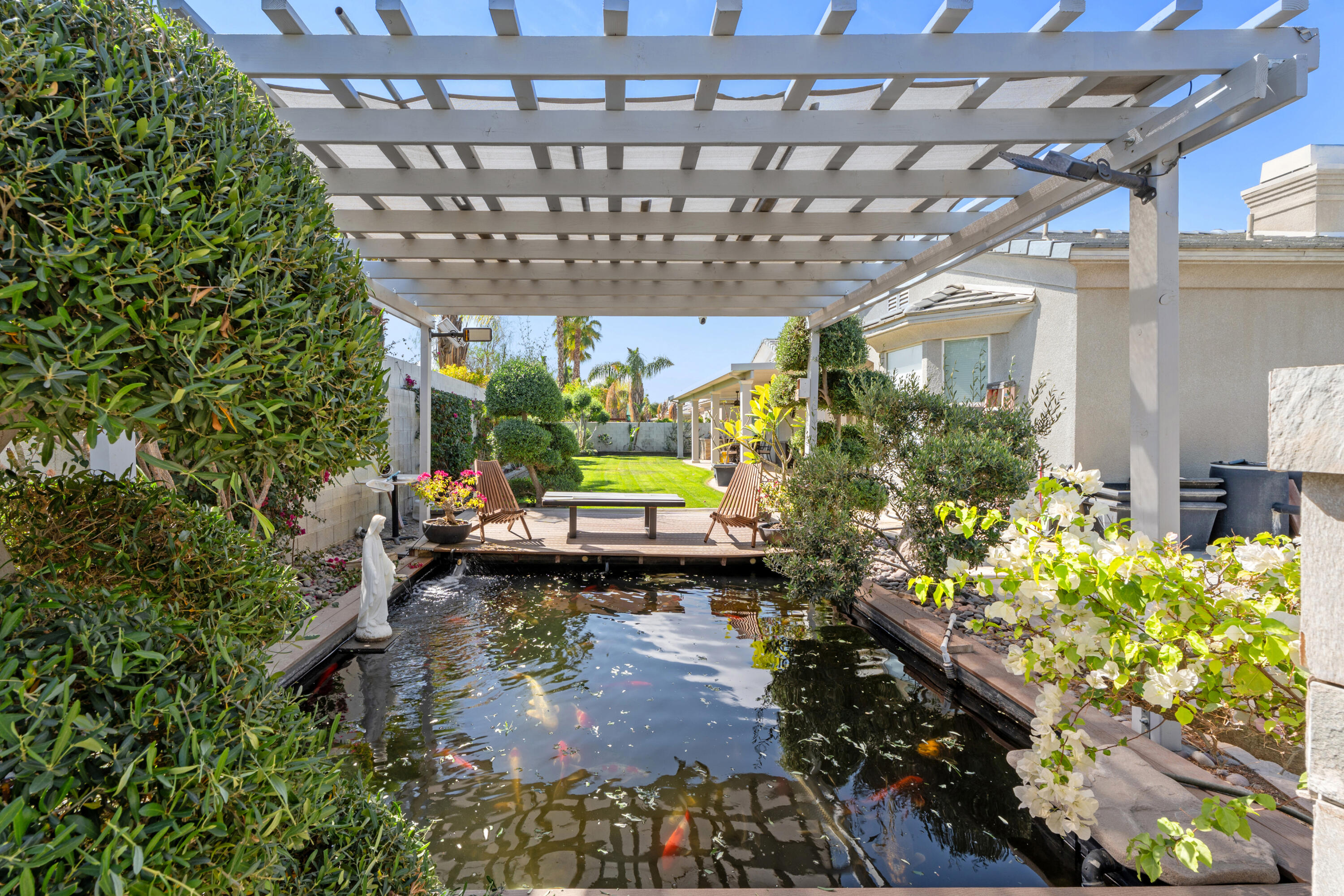 a view of swimming pool with a outdoor seating